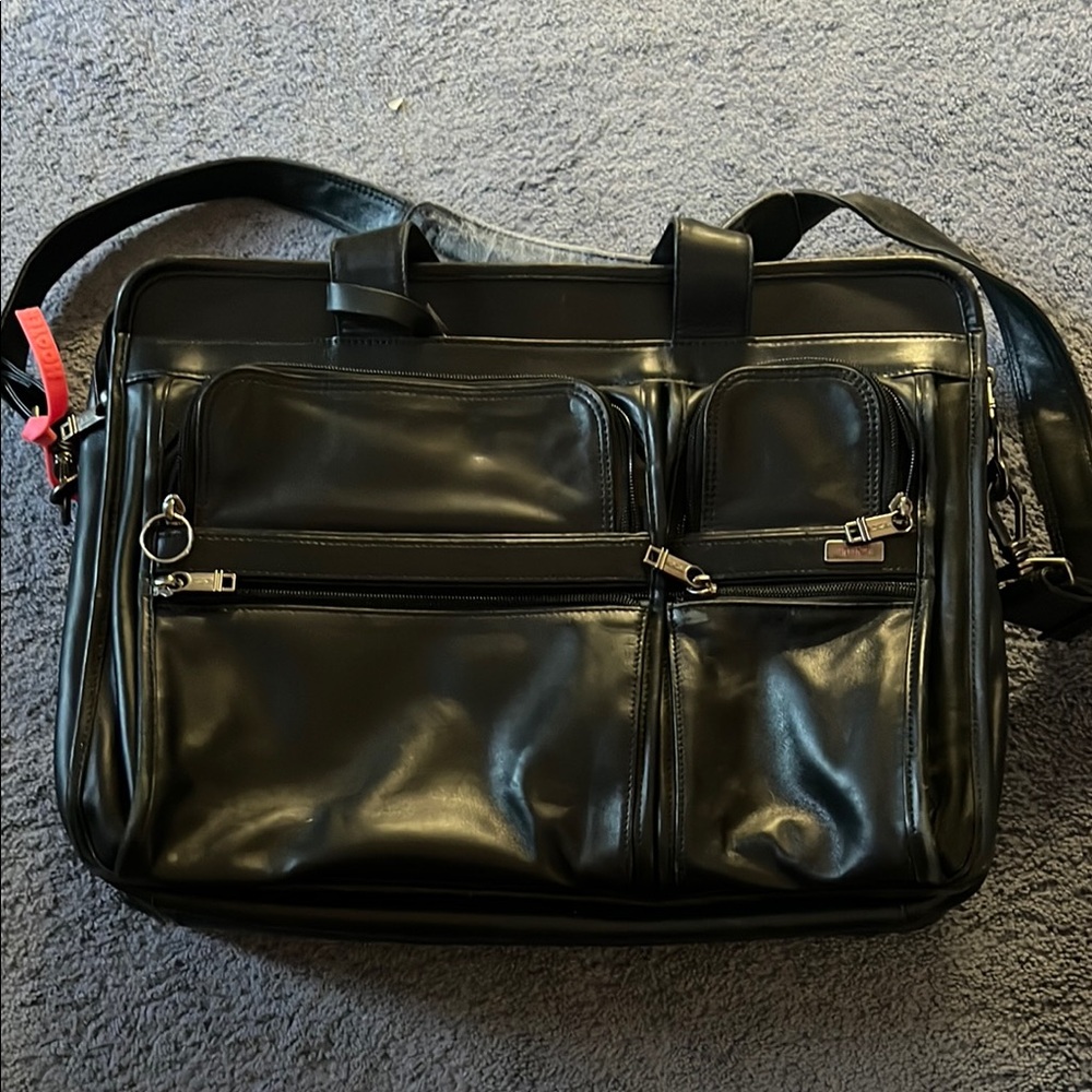 Tumi Black Briefcase with Adjustable Strap and Metal Hardware